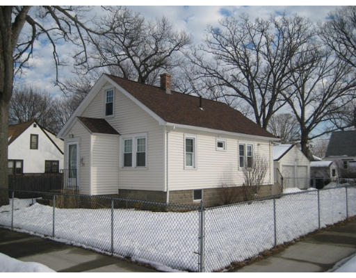 91 Fresno Street Springfield, MA 01104 - Photo 5 of 18 a view of a white house with a yard