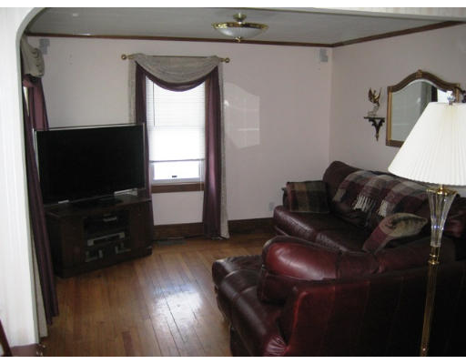 91 Fresno Street Springfield, MA 01104 - Photo 8 of 18 a living room with furniture and a flat screen tv