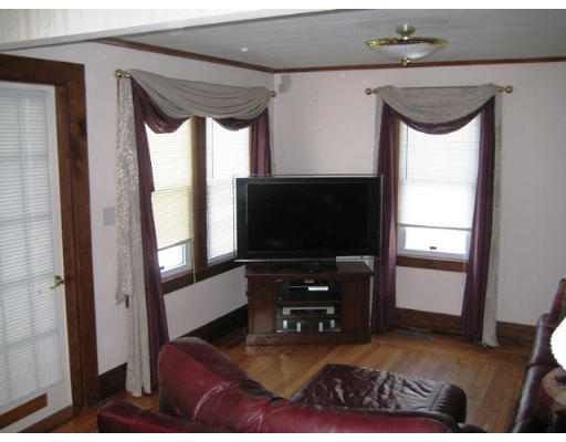 91 Fresno Street Springfield, MA 01104 - Photo 9 of 18 a living room with furniture and a flat screen tv