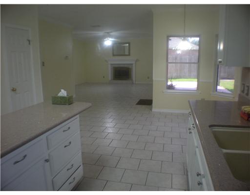 5113 Kings Court Corpus Christi, TX 78413 - Photo 3 of 10 a bathroom with a sink and a mirror