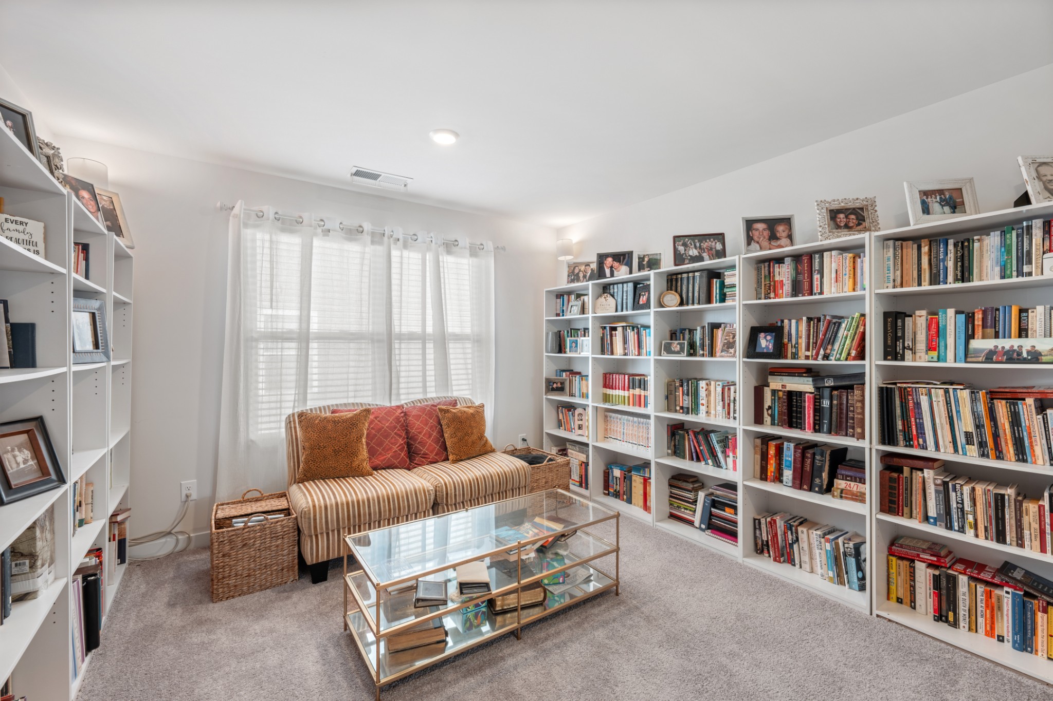 158 Southwind Run Spring Hill, TN 37174 - Photo 21 of 43 a living room with furniture and a book shelf