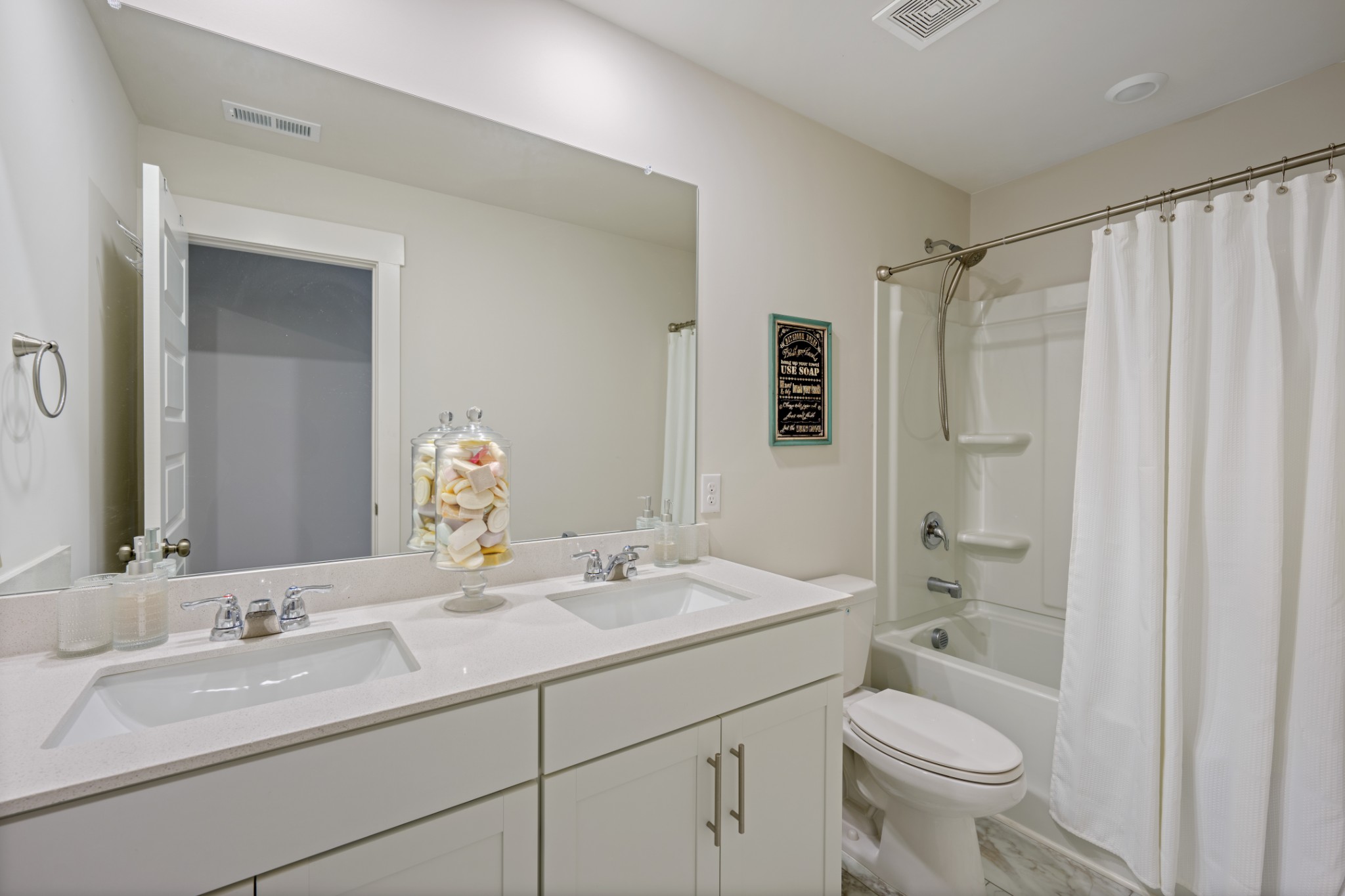 158 Southwind Run Spring Hill, TN 37174 - Photo 27 of 43 a bathroom with a double vanity sink toilet mirror and shower
