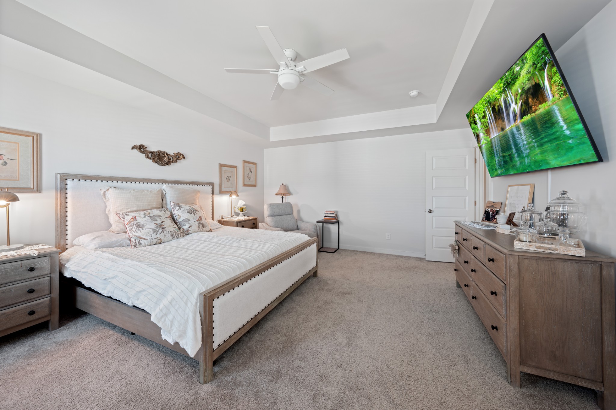 158 Southwind Run Spring Hill, TN 37174 - Photo 30 of 43 a spacious bedroom with a bed and a chandelier