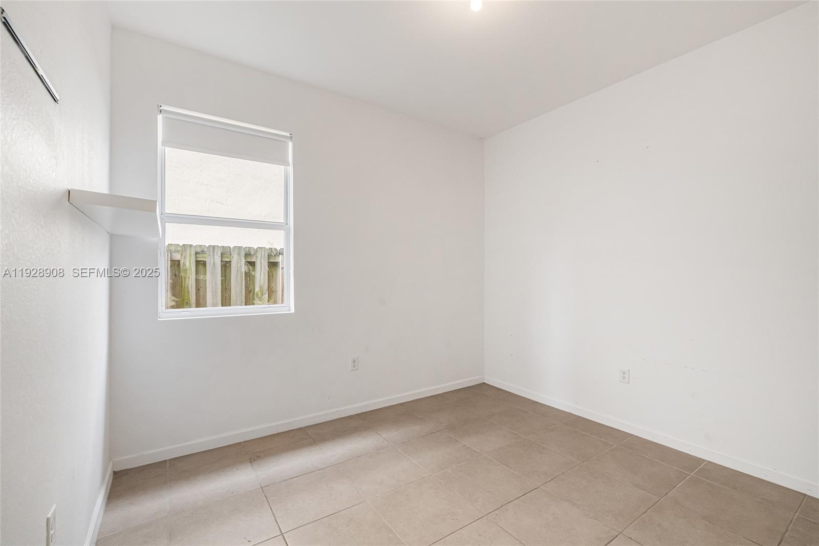 11863 Southwest 253rd Terrace Homestead, FL 33032 - Photo 12 of 30 a view of an empty room with a window