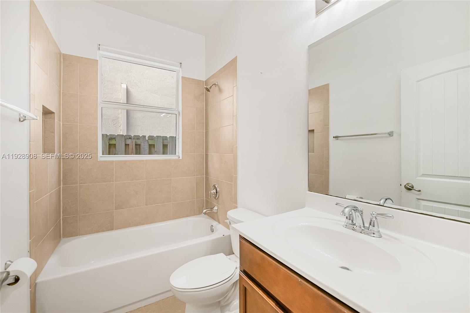11863 Southwest 253rd Terrace Homestead, FL 33032 - Photo 14 of 30 a bathroom with a sink toilet tub and shower
