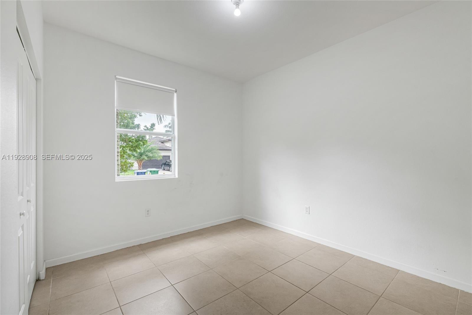 11863 Southwest 253rd Terrace Homestead, FL 33032 - Photo 20 of 30 an empty room with windows