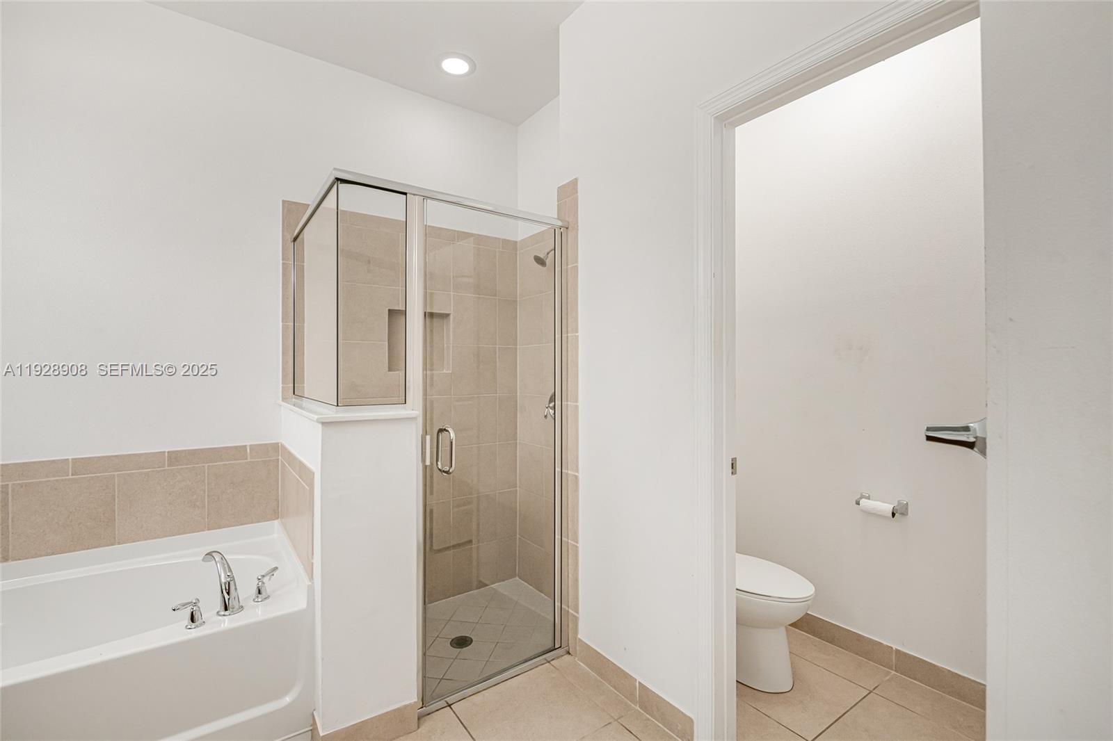 11863 Southwest 253rd Terrace Homestead, FL 33032 - Photo 22 of 30 a bathroom with a shower a toilet and a shower