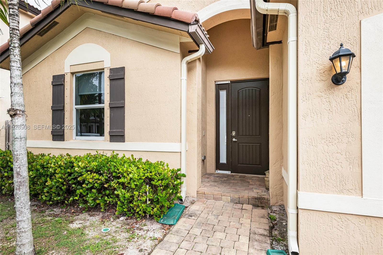 11863 Southwest 253rd Terrace Homestead, FL 33032 - Photo 3 of 30 a view of a front door and a window