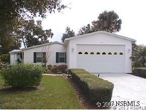 403 Portside Lane Edgewater, FL 32141 - Photo 1 of 12 a view of a back yard of the house