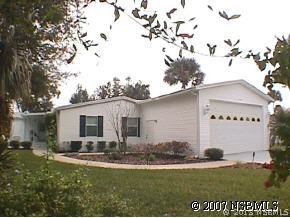 403 Portside Lane Edgewater, FL 32141 - Photo 2 of 12 a view of a house with a yard