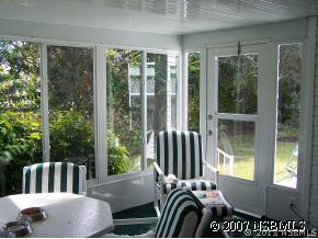 403 Portside Lane Edgewater, FL 32141 - Photo 3 of 12 a balcony view with a large window and outdoor space
