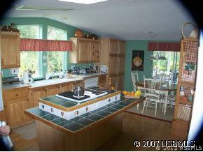 403 Portside Lane Edgewater, FL 32141 - Photo 6 of 12 a room with furniture and a large window