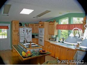 403 Portside Lane Edgewater, FL 32141 - Photo 7 of 12 a living room with furniture and a large window