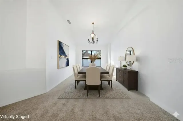 a view of a livingroom with a ceiling fan and window