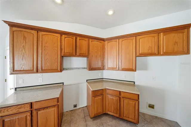 a view of a livingroom with a ceiling fan and window