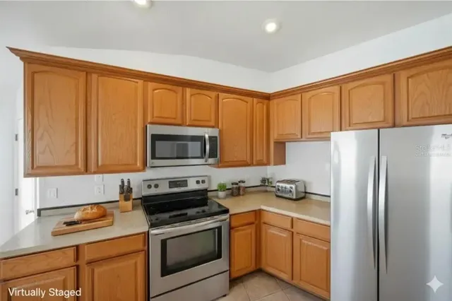 an empty room with closet and a ceiling fan