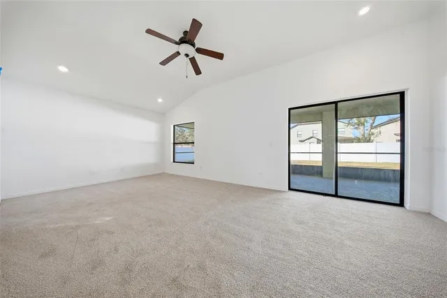 a view of a house with backyard and garden
