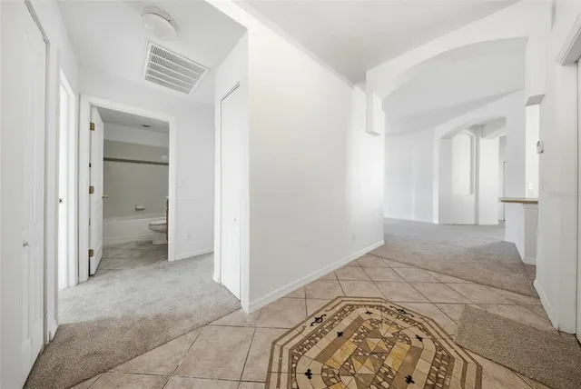 a view of an empty room with a window