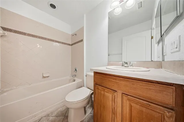 a kitchen with stainless steel appliances granite countertop a refrigerator stove microwave and sink