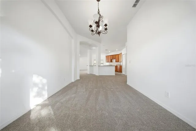 a view of a utility room with a sink and a window