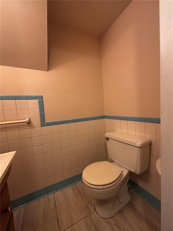 200 Foxcroft Road Pittsburgh, PA 15220 - Photo 23 of 43 a white toilet sitting next to a bathroom sink