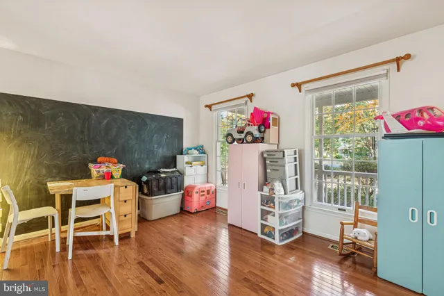 a view of a livingroom with furniture and wooden floor