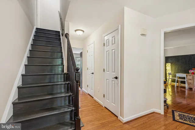 a bedroom with a bed and a television