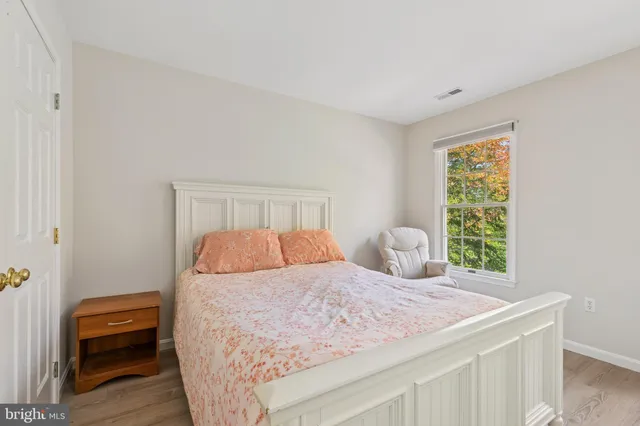 a bed room with furniture and a window
