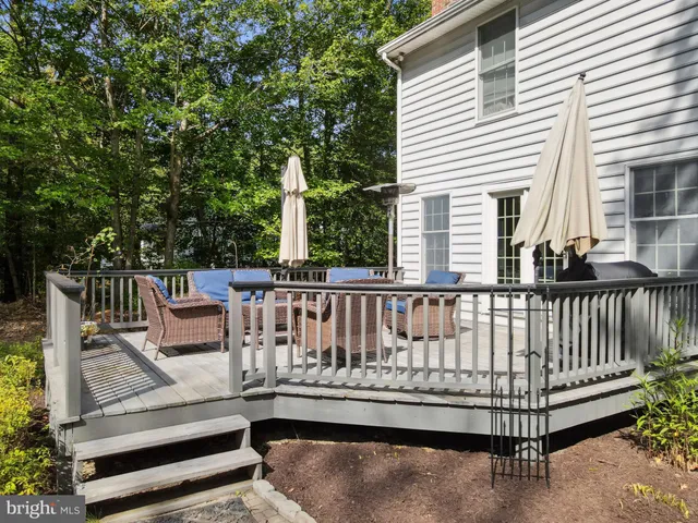 a view of a roof deck with furniture