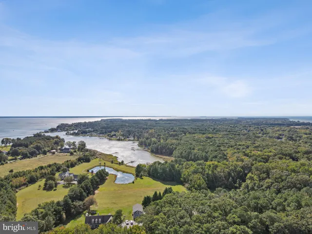 a view of a lake with houses with outdoor space