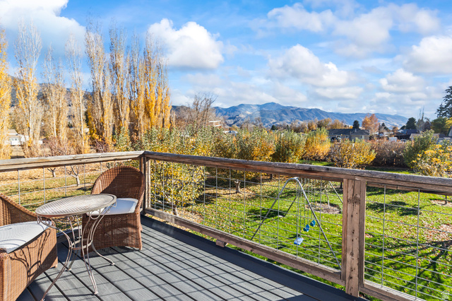 390 North 100 West Monroe, UT 84754 - Photo 139 of 167 Deck featuring a mountain view and a yard