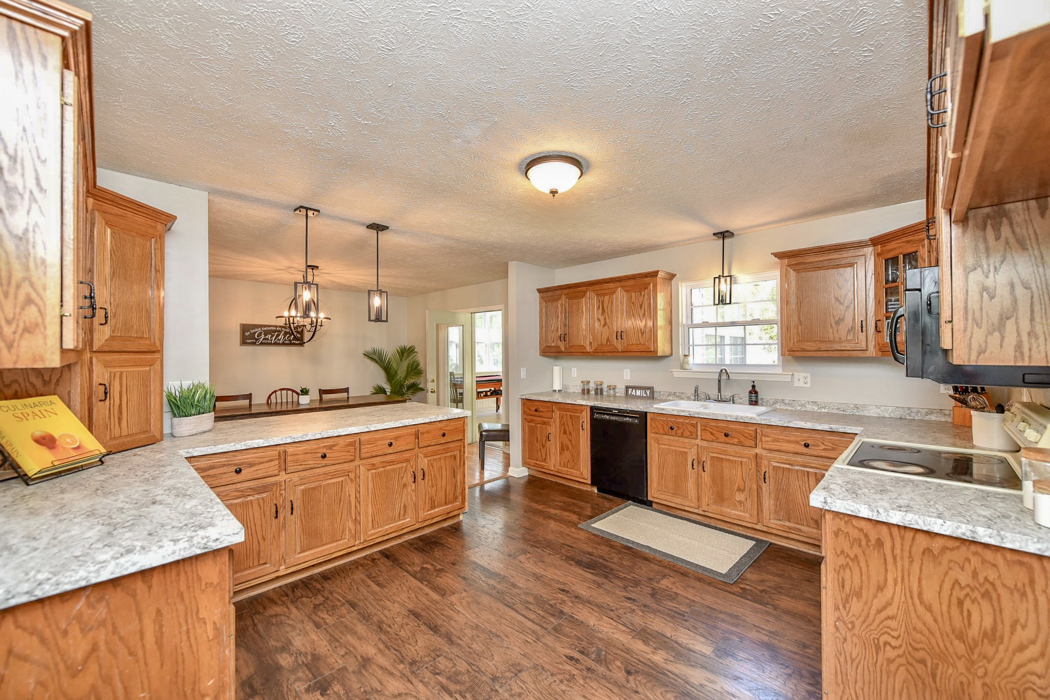 1059 North Corinth Road Portland, TN 37148 - Photo 18 of 40 a large kitchen with granite countertop a sink counter space and appliances