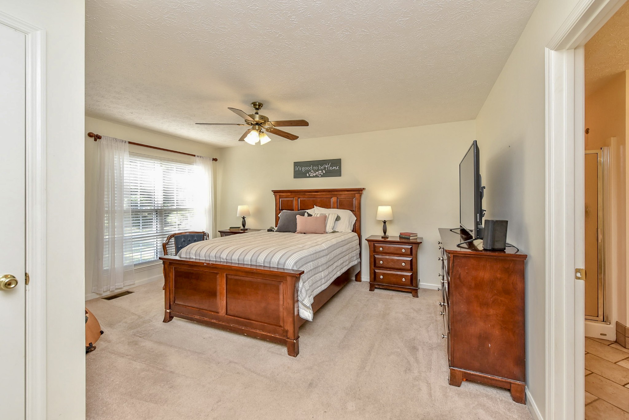 1059 North Corinth Road Portland, TN 37148 - Photo 22 of 40 a bedroom with a bed and a chandelier