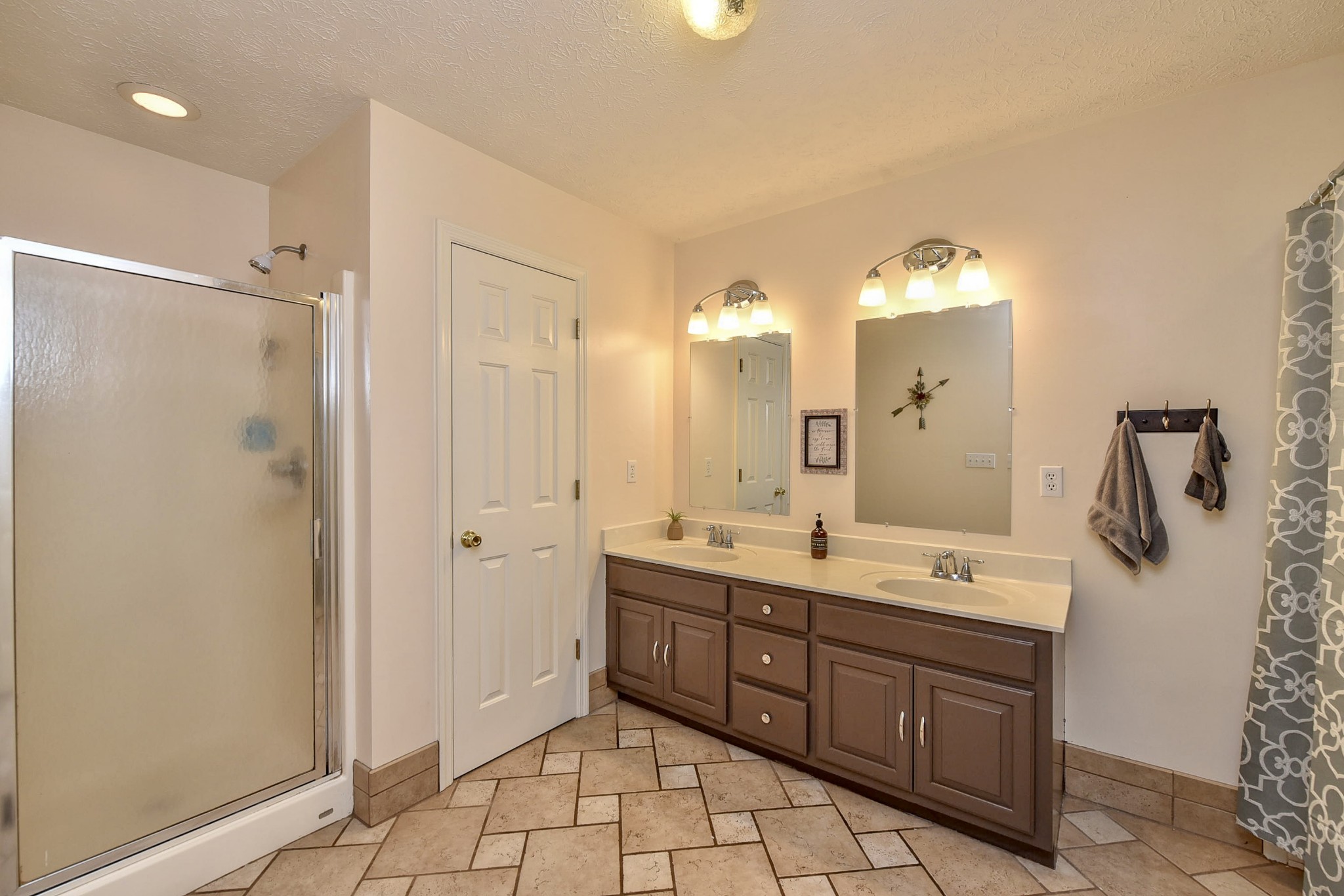 1059 North Corinth Road Portland, TN 37148 - Photo 23 of 40 a spacious bathroom with a double vanity sink mirror and shower