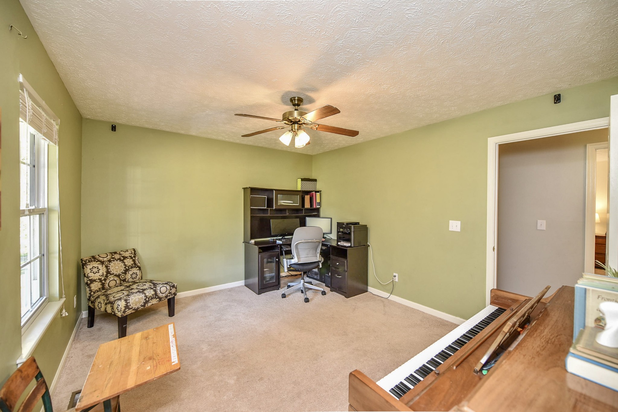 1059 North Corinth Road Portland, TN 37148 - Photo 26 of 40 a work room with furniture and a ceiling fan