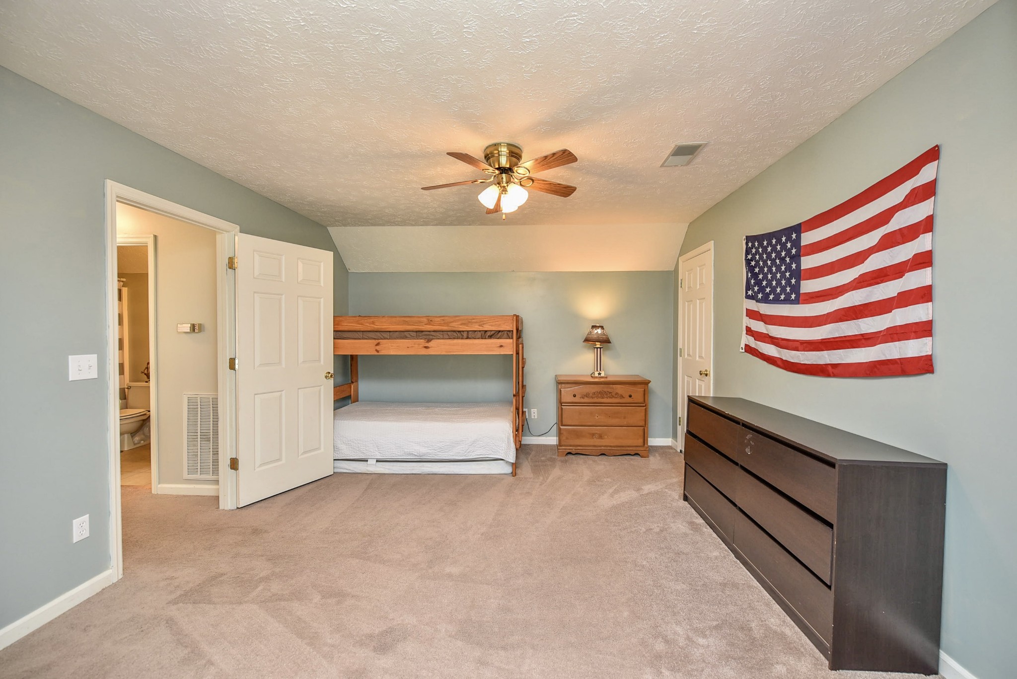1059 North Corinth Road Portland, TN 37148 - Photo 31 of 40 an empty room with furniture and a chandelier fan