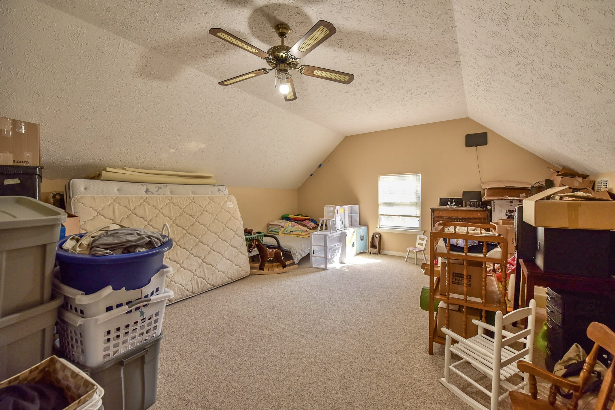 1059 North Corinth Road Portland, TN 37148 - Photo 34 of 40 a bedroom with furniture and a chandelier