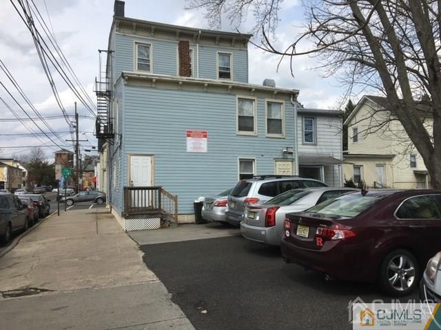 68 Guilden Street New Brunswick, NJ 08901 - Photo 3 of 3 a couple of cars parked in front of a house
