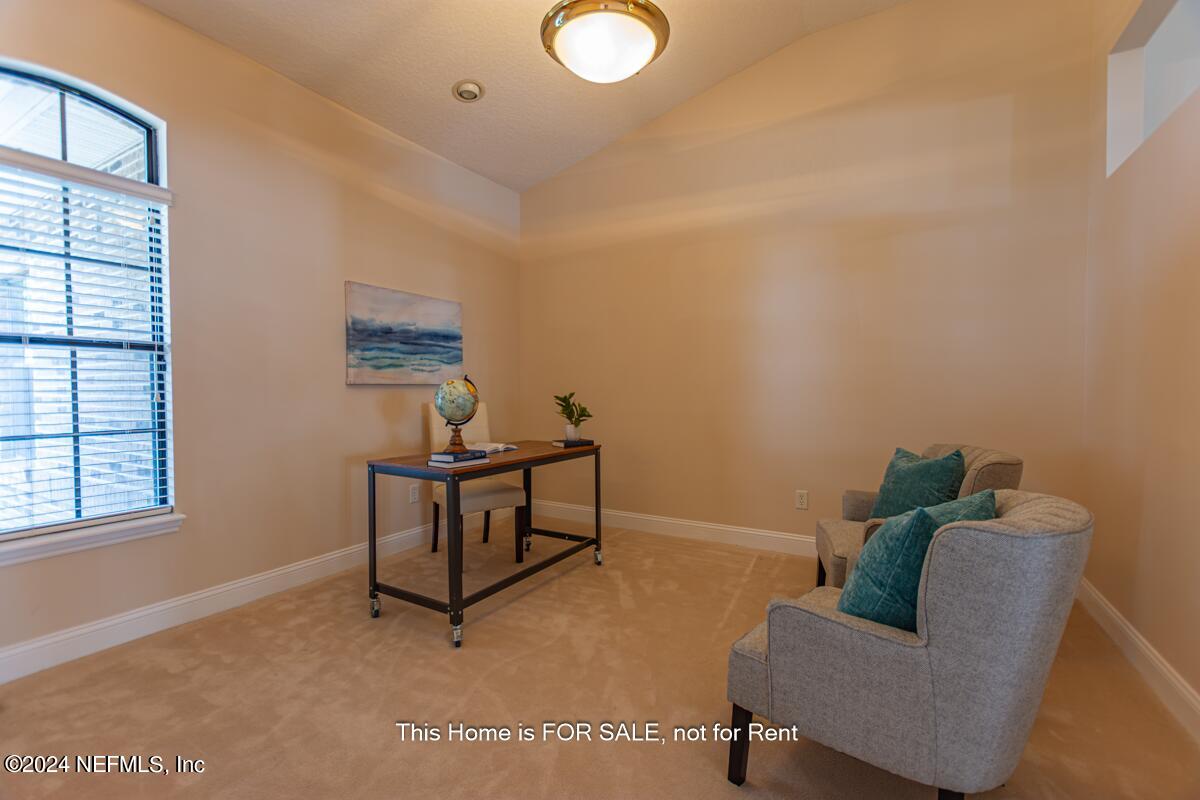 5745 Sheffield Road Jacksonville, FL 32226 - Photo 15 of 57 a living room with furniture and a window