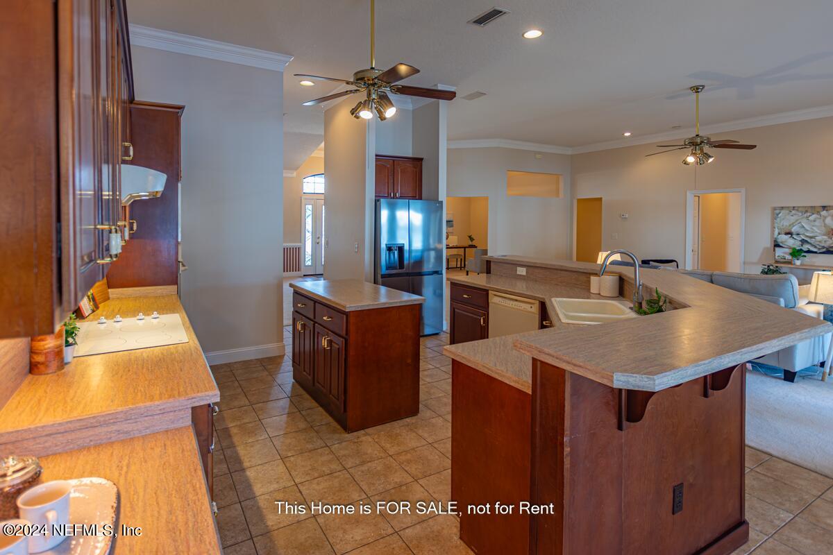5745 Sheffield Road Jacksonville, FL 32226 - Photo 20 of 57 a kitchen with sink a counter top space and appliances
