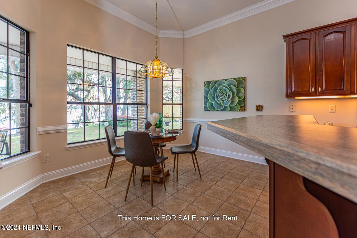 5745 Sheffield Road Jacksonville, FL 32226 - Photo 23 of 57 a dining room with furniture and window