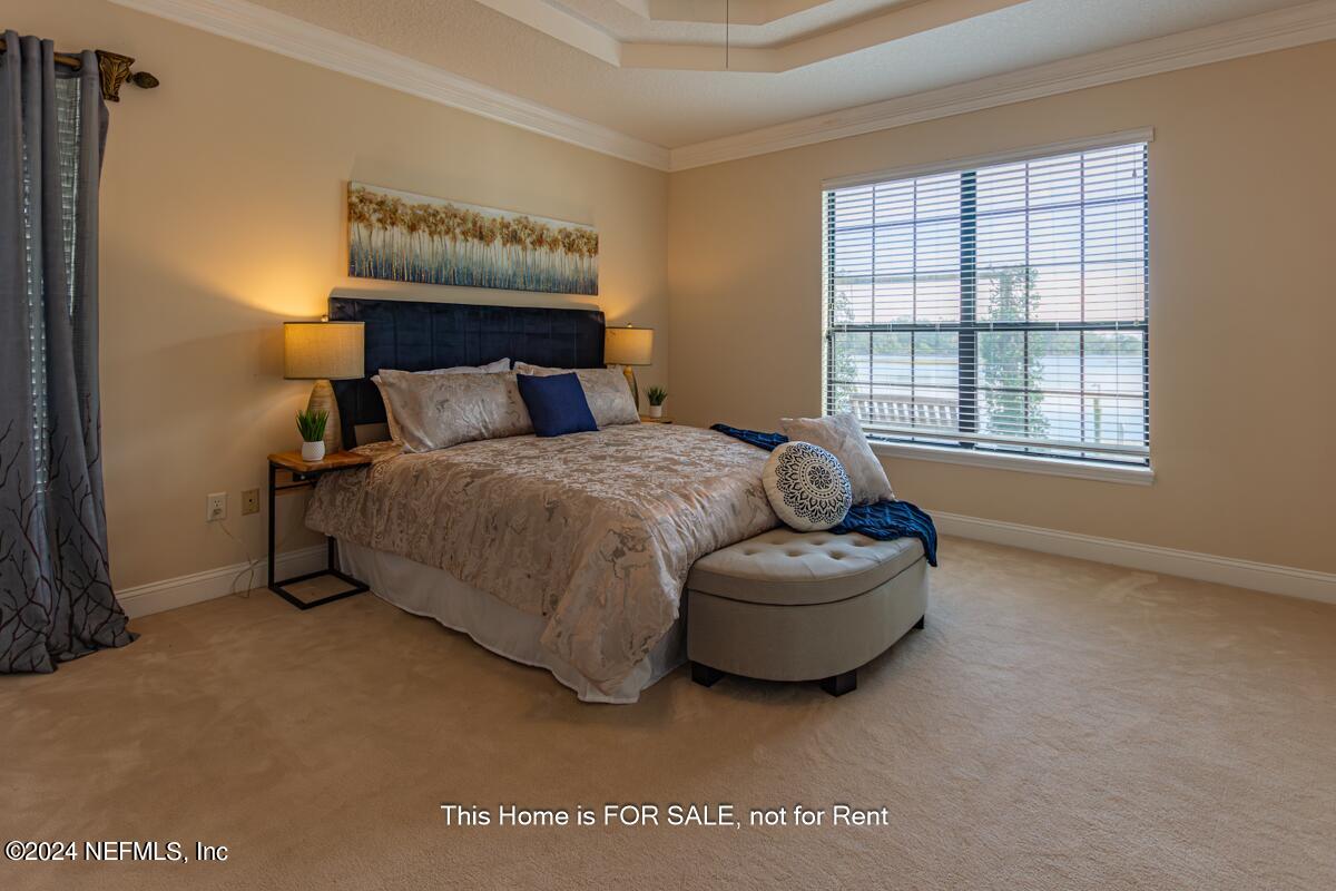 5745 Sheffield Road Jacksonville, FL 32226 - Photo 25 of 57 a bedroom with a bed and window