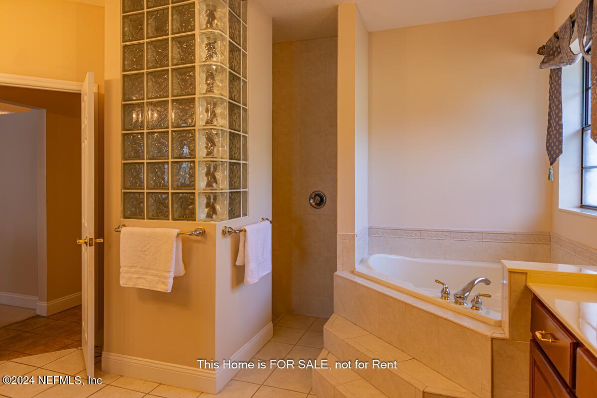 5745 Sheffield Road Jacksonville, FL 32226 - Photo 29 of 57 a bathroom with a tub and a sink