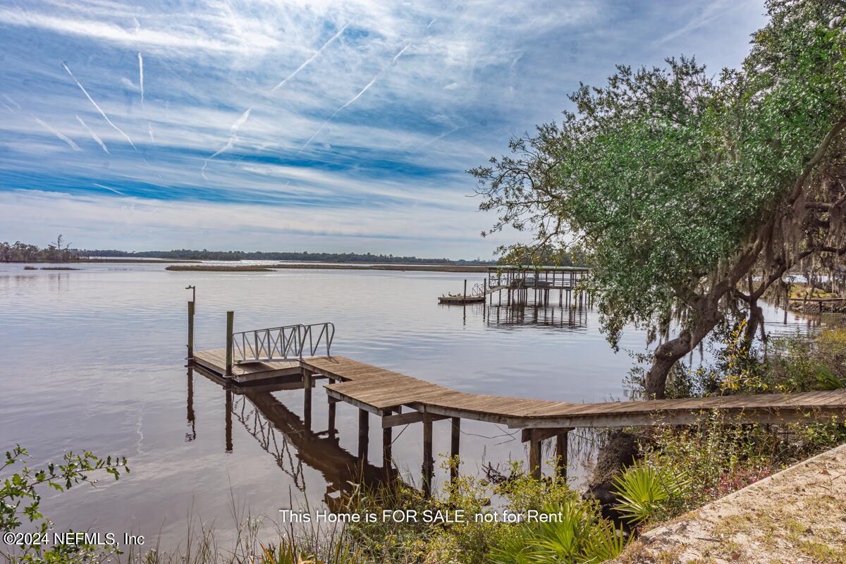 5745 Sheffield Road Jacksonville, FL 32226 - Photo 3 of 57 a view of a balcony with wooden floor and lake view