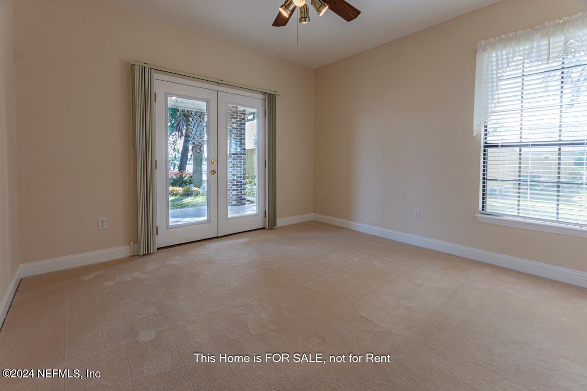 5745 Sheffield Road Jacksonville, FL 32226 - Photo 38 of 57 an empty room with windows and closet