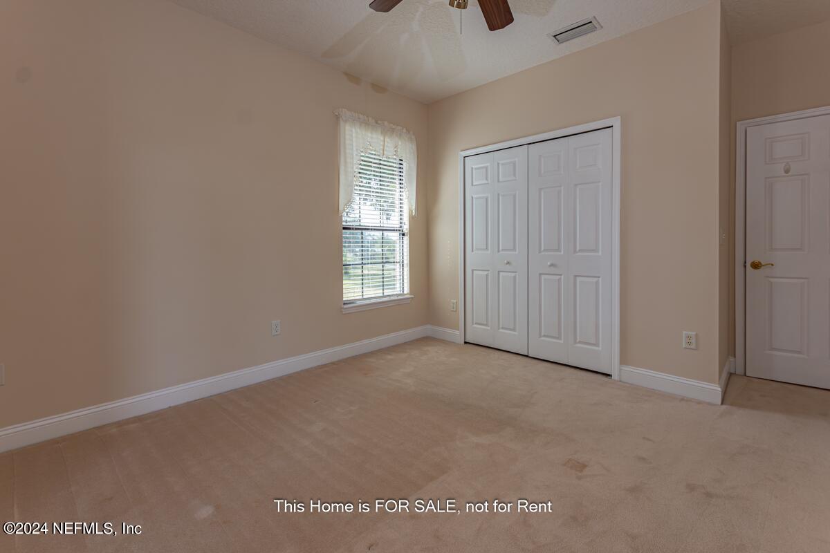 5745 Sheffield Road Jacksonville, FL 32226 - Photo 39 of 57 an empty room with windows