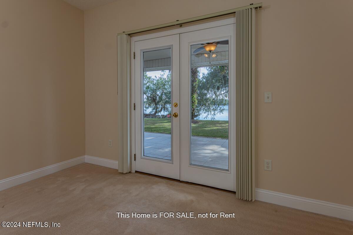 5745 Sheffield Road Jacksonville, FL 32226 - Photo 40 of 57 a view of an empty room with glass door