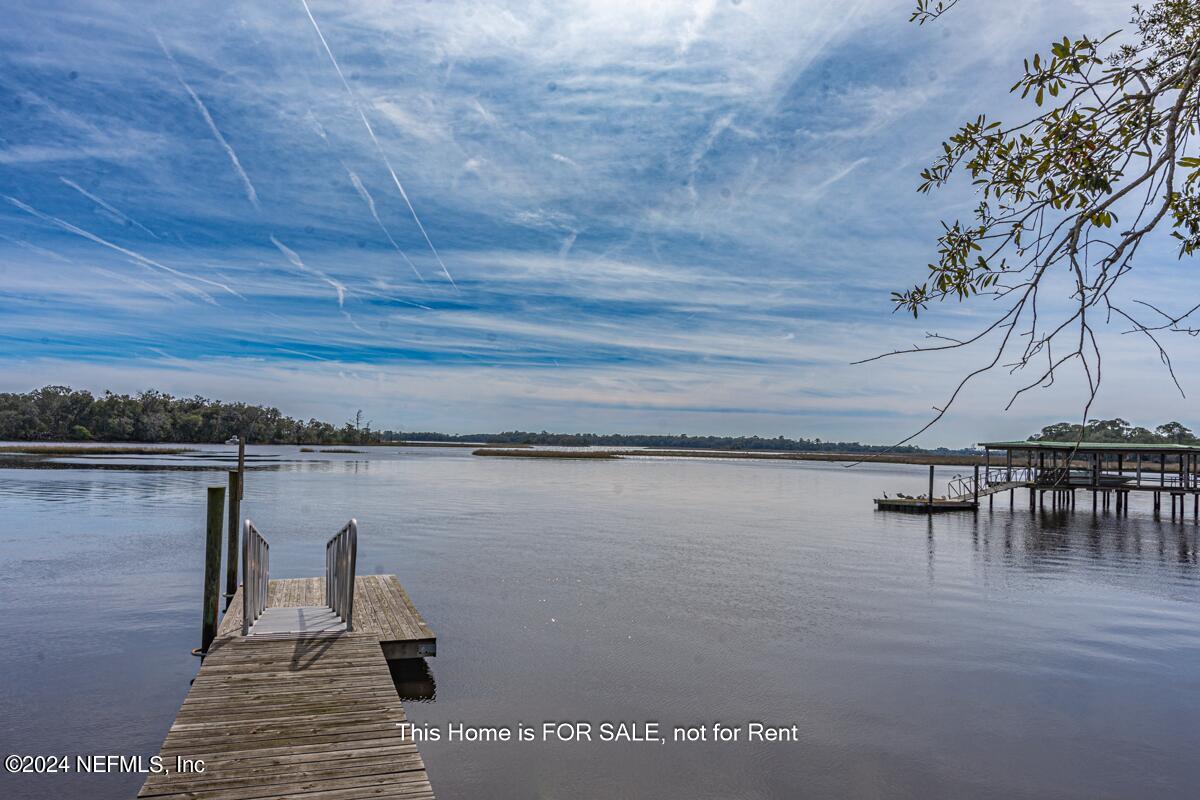 5745 Sheffield Road Jacksonville, FL 32226 - Photo 45 of 57 a view of a lake with sitting area
