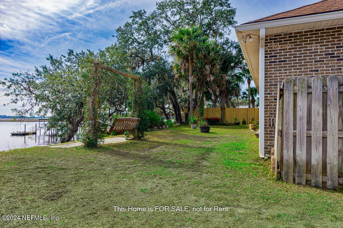 5745 Sheffield Road Jacksonville, FL 32226 - Photo 48 of 57 a view of a backyard with a garden