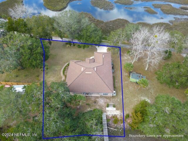 5745 Sheffield Road Jacksonville, FL 32226 - Photo 55 of 57 an aerial view of a house with a yard and large trees